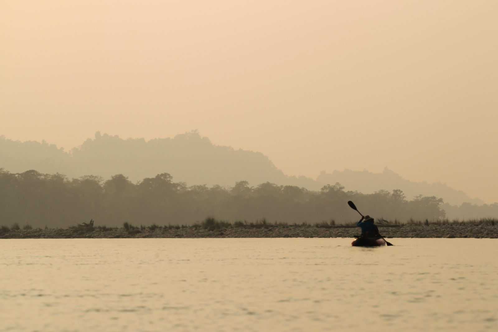 view of babaioutback room at night with outdoor lighting